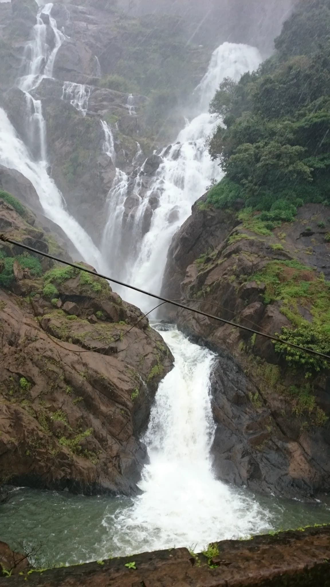 Mist rising over Dudhsagar Falls